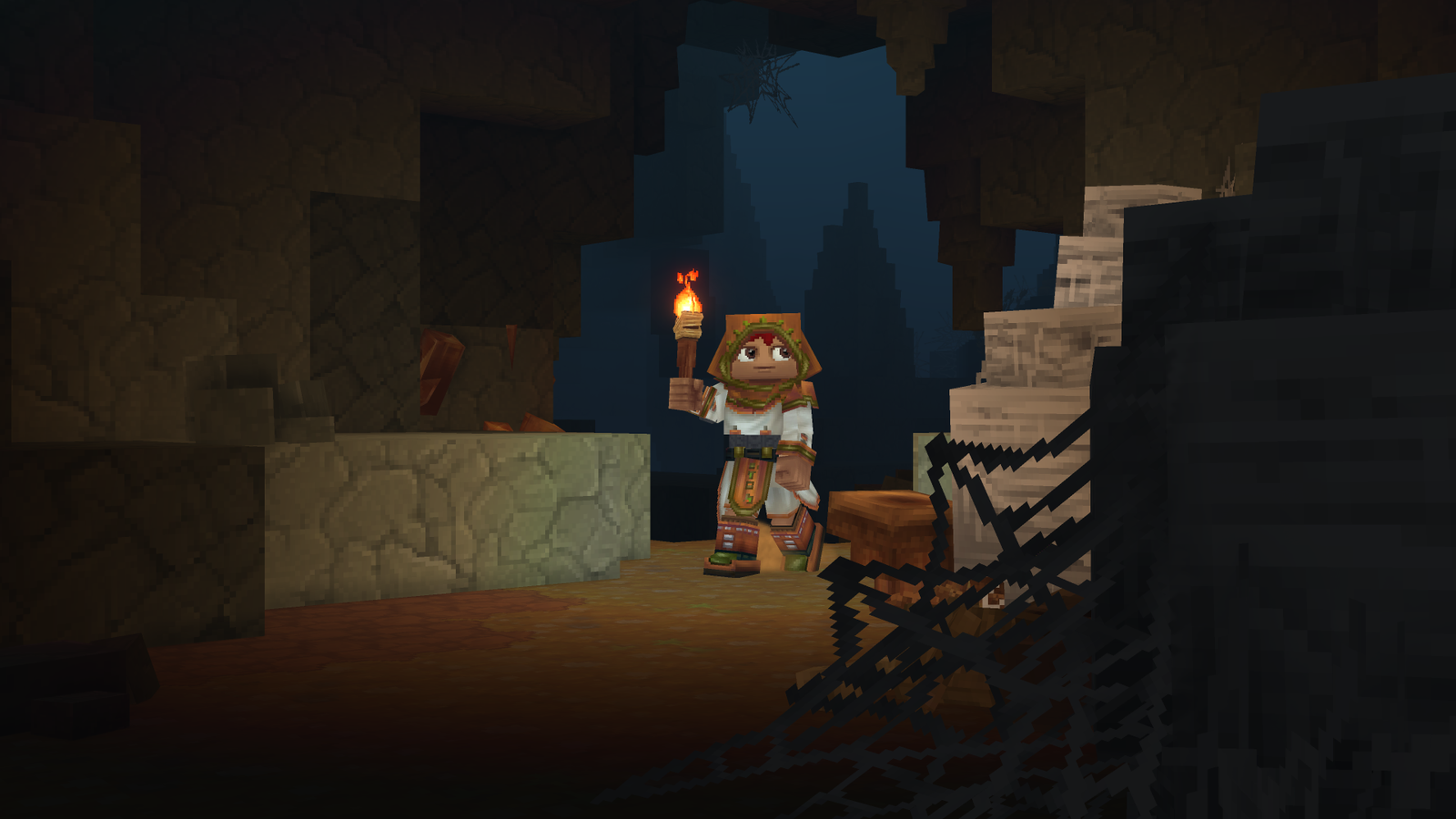 An adventurer exploring a torch-lit cave.